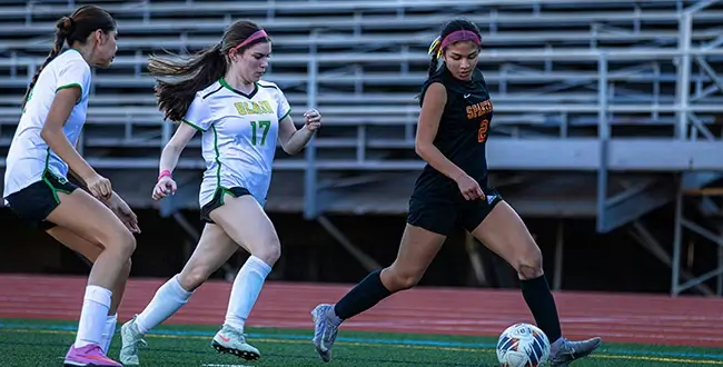 Student athletes playing soccer