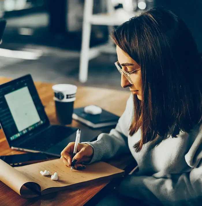 Woman writing in journal